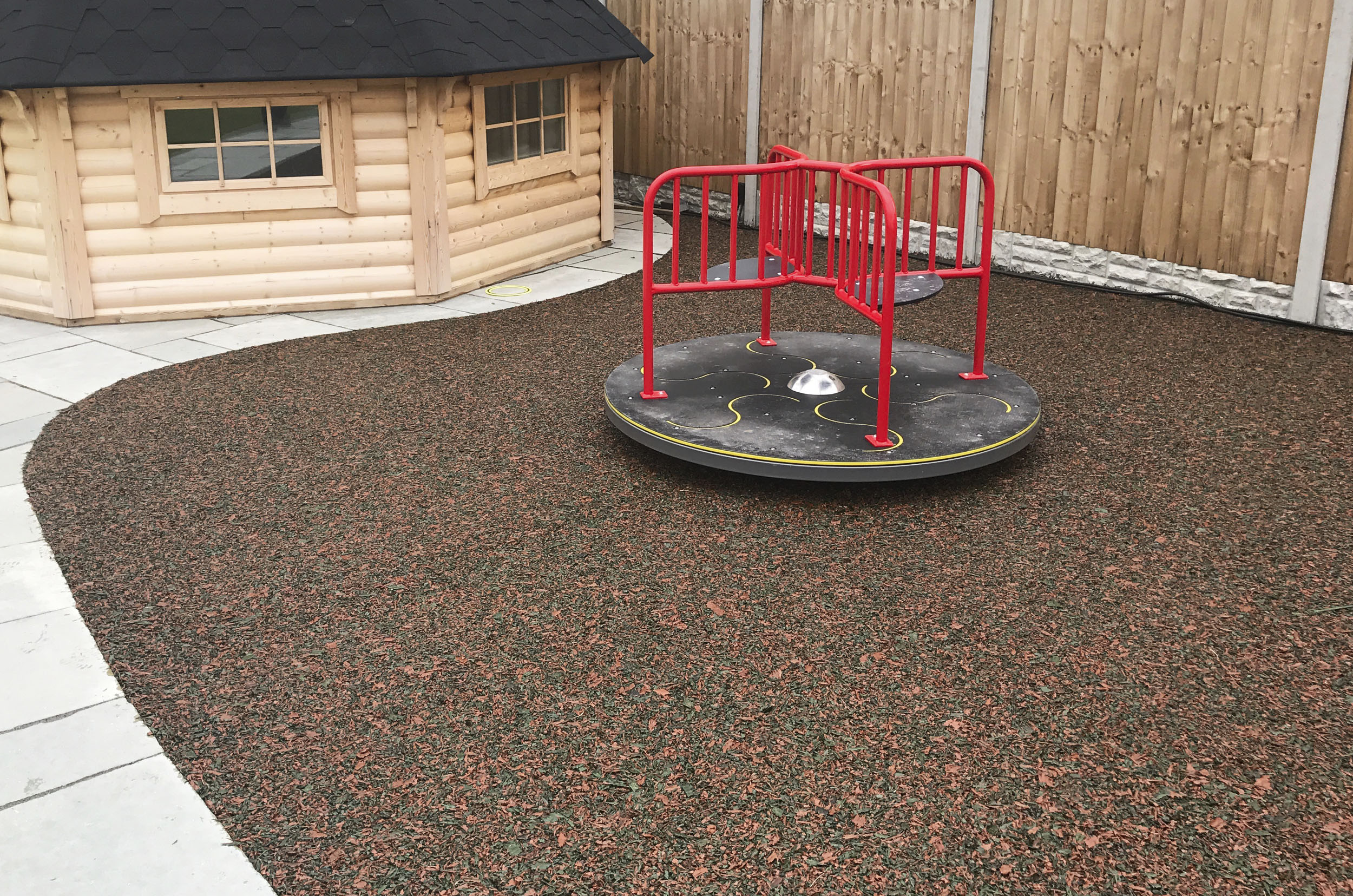 Mulch Wetpour Safer Surfacing - Mixed Colour installed underneath a roundabout