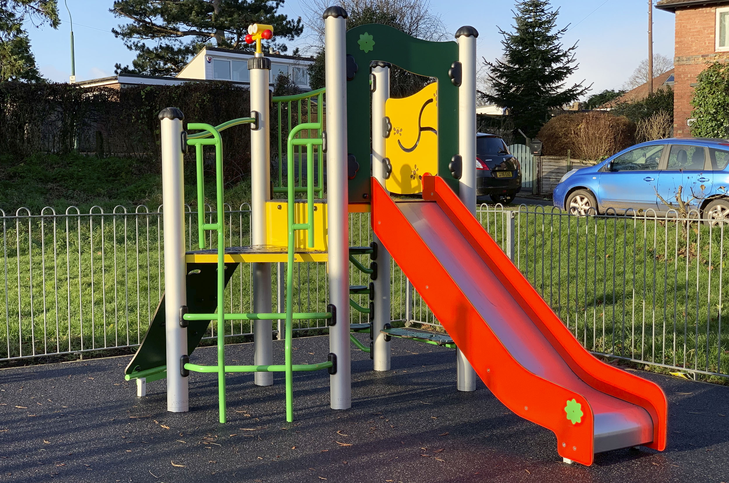 Spider Multiplay, green and orange ramp, green Ladd, red slide, yellow play panels