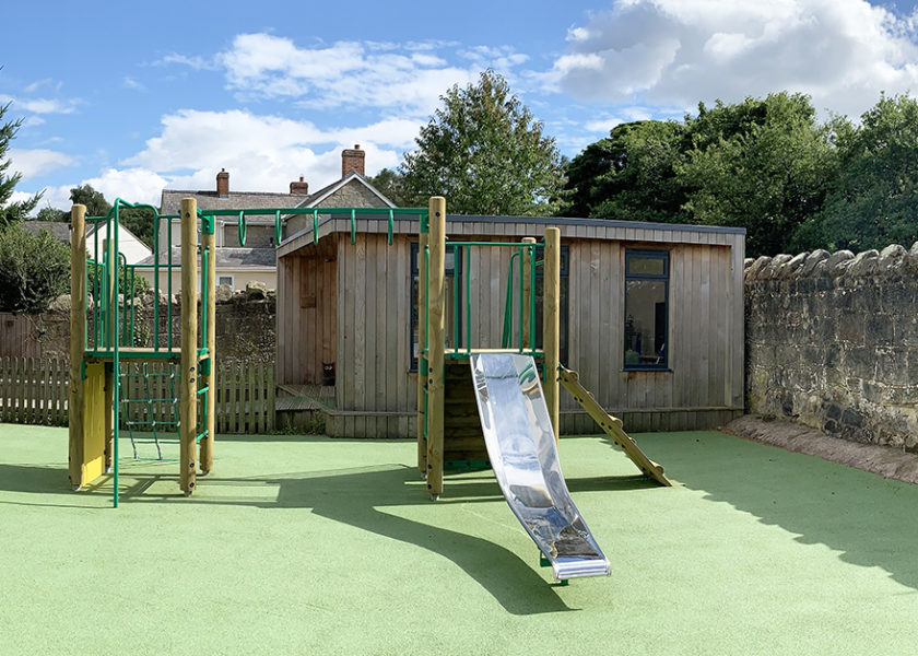 Clive School timber multiplay climber on green wetpour safer surfacing